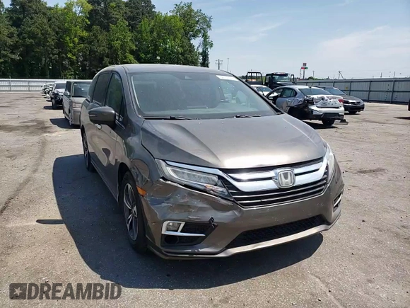 2019 Honda Odyssey Touring z VIN 5FNRL6H87KB098010, wystawiony jako Copart lot #54791505 z przebiegiem 94 477 mil mil oraz Szkoda całkowita • Salvage title. Historia ofert i sprzedaży dostępna na DreamBid. Obrazek 14.