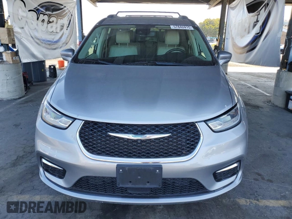 2021 Chrysler Pacifica Hybrid Touring L with VIN 2C4RC1L7XMR593911, listed as a Copart auction lot 57842415 with 74,910 mi miles and Salvage title. Bid and sale history available at DreamBid. Image 5.