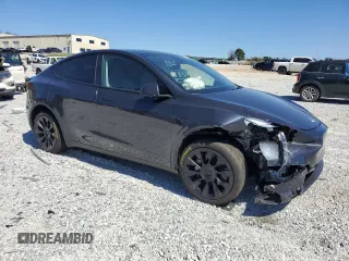 2025 Tesla Model Y Long Range with VIN 7SAYGAEEXSF253326, listed as a Copart auction lot 49527965 with 5,803 mi miles and Salvage Title. Bid and sale history available at DreamBid. Image 4.
