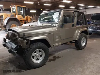 2004 Jeep Wrangler Sahara with VIN 1J4FA59S64P736389, listed as a IAAI auction lot 41432819 with 102,830 mi miles. Bid and sale history available at carsss.com. Image 2.