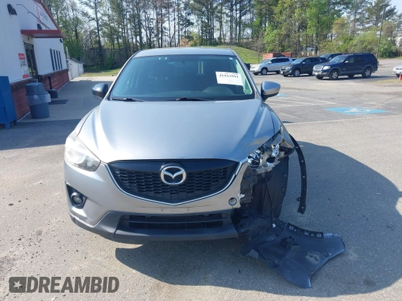 2014 Mazda CX-5 Touring with VIN JM3KE2CY9E0310315, listed as a IAAI auction lot 41943991 with 98,359 mi miles and . Bid and sale history available at carsss.com. Image 12.