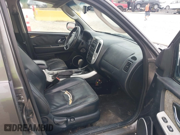 2006 Mercury Mariner Luxury with VIN 4M2CU57116KJ07577, listed as a IAAI auction lot 41448284 with 164,642 mi miles and . Bid and sale history available at DreamBid. Image 5.
