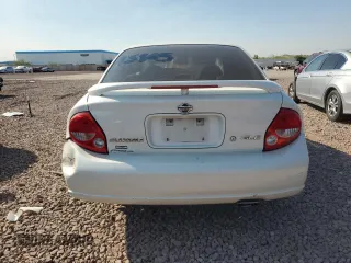 2001 Nissan Maxima GXE z VIN JN1CA31D71T827204, wystawiony jako Copart lot #71219104 z przebiegiem 195 343 mil mil oraz Szkoda całkowita • Salvage title. Historia ofert i sprzedaży dostępna na DreamBid. Obrazek 6.