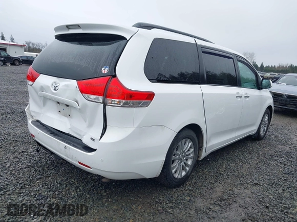2014 Toyota Sienna XLE with VIN 5TDYK3DC2ES485846, listed as a IAAI auction lot 41693092 with 106,156 mi miles and . Bid and sale history available at DreamBid. Image 4.