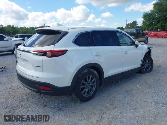 2022 Mazda CX-9 Touring z VIN JM3TCBCY7N0600787, wystawiony jako IAAI lot #42240512 z przebiegiem 27 927 mil mil oraz . Historia ofert i sprzedaży dostępna na DreamBid. Obrazek 4.