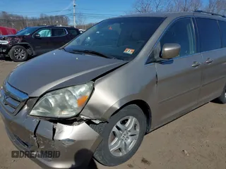 2006 Honda Odyssey EX-L z VIN 5FNRL38736B069969, wystawiony jako IAAI lot #41695311 z przebiegiem 196 218 mil mil oraz . Historia ofert i sprzedaży dostępna na DreamBid. Obrazek 6.