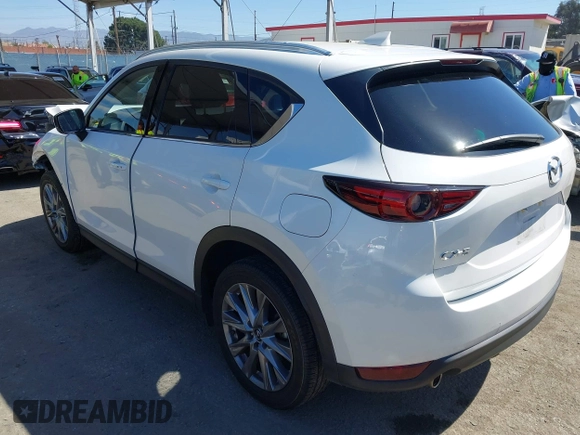 2020 Mazda CX-5 Grand Touring with VIN JM3KFADM0L1838495, listed as a IAAI auction lot 41991566 with 32,021 mi miles. Bid and sale history available at carsss.com. Image 3.