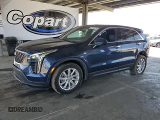 2022 Cadillac XT4 FWD Luxury with VIN 1GYAZAR40NF120224, listed as a Copart auction lot 61100285 with 35,260 mi miles and Salvage title. Bid and sale history available at DreamBid. Image 1.
