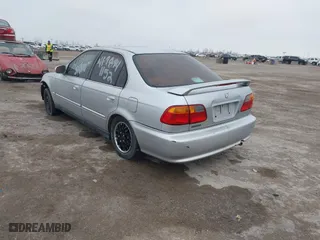1999 Honda Civic EX with VIN 1HGEJ8649XL023282, listed as a IAAI auction lot 41496406 with 229,003 mi miles. Bid and sale history available at carsss.com. Image 3.