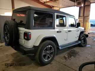 2023 Jeep Wrangler Sahara with VIN 1C4HJXEN1PW659600, listed as a Copart auction lot 85228074 with 21,623 mi miles and Salvage Title. Bid and sale history available at carsss.com. Image 3.