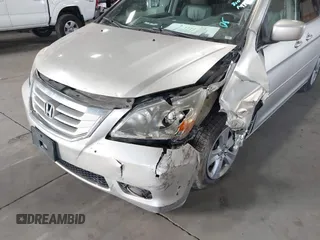 2009 Honda Odyssey Touring с VIN 5FNRL38979B005813, выставлен на аукционе IAAI как лот 41049383 с пробегом 174 897 миль миль и . История ставок и продаж доступна на DreamBid. Изображение 6.