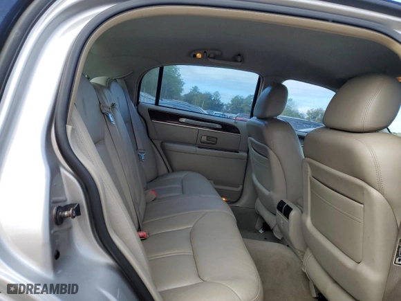 2003 Lincoln Town Car Cartier with VIN 1LNHM83W23Y639990, listed as a Copart auction lot 85591924 with 124,515 mi miles and Salvage Title. Bid and sale history available at carsss.com. Image 10.