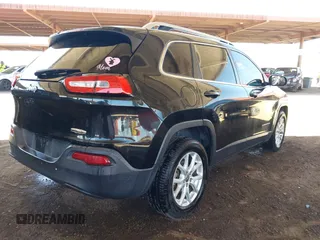 2015 Jeep Cherokee Latitude with VIN 1C4PJLCB8FW669150, listed as a IAAI auction lot 42122669 with 194,525 mi miles and . Bid and sale history available at DreamBid. Image 4.
