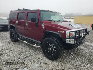 2005 Hummer H2 SUV with VIN 5GRGN23U35H128685, listed as a Copart auction lot 43031545 with 132,053 mi miles and Salvage Title. Bid and sale history available at carsss.com. Image 4.