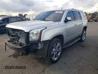 2018 GMC Yukon Denali with VIN 1GKS2CKJ4JR161009, listed as a Copart auction lot 74598914 with 106,891 mi miles and Salvage Title. Bid and sale history available at carsss.com. Image 1.