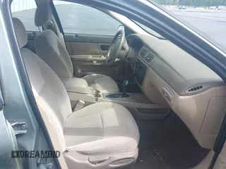 2005 Ford Taurus SE with VIN 1FAFP53U55A209369, listed as a IAAI auction lot 42144800 with 152,446 mi miles. Bid and sale history available at carsss.com. Image 5.