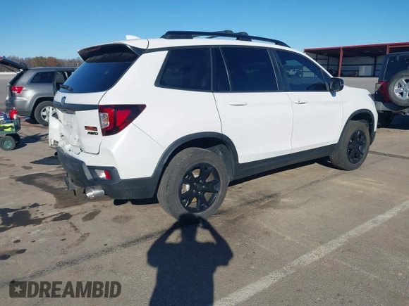 2023 Honda Passport TrailSport z VIN 5FNYF8H68PB007654, wystawiony jako IAAI lot #40816118 z przebiegiem 35 656 mil mil oraz . Historia ofert i sprzedaży dostępna na DreamBid. Obrazek 4.
