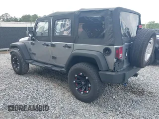 2014 Jeep Wrangler Unlimited Sport with VIN 1C4BJWDG3EL135351, listed as a IAAI auction lot 41947408 with 104,460 mi miles. Bid and sale history available at carsss.com. Image 3.