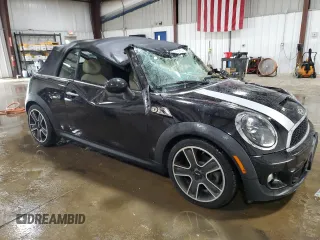 2013 MINI Convertible S with VIN WMWZP3C51DT297891, listed as a Copart auction lot 56745065 with 101,292 mi miles and Salvage title. Bid and sale history available at DreamBid. Image 4.