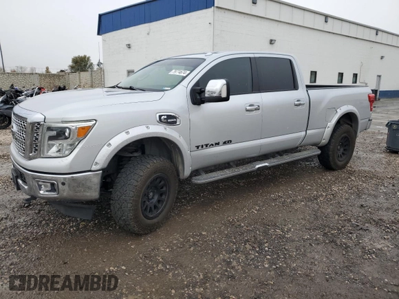 2016 Nissan Titan XD PRO-4X with VIN 1N6BA1F45GN517682, listed as a Copart auction lot 79774674 with 149,675 mi miles and Salvage Title. Bid and sale history available at carsss.com. Image 1.