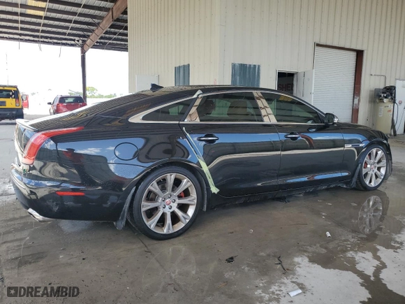 2014 Jaguar XJ with VIN SAJWA2GZ4E8V60864, listed as a Copart auction lot 76478674 with 50,578 mi miles and Salvage Title. Bid and sale history available at carsss.com. Image 3.