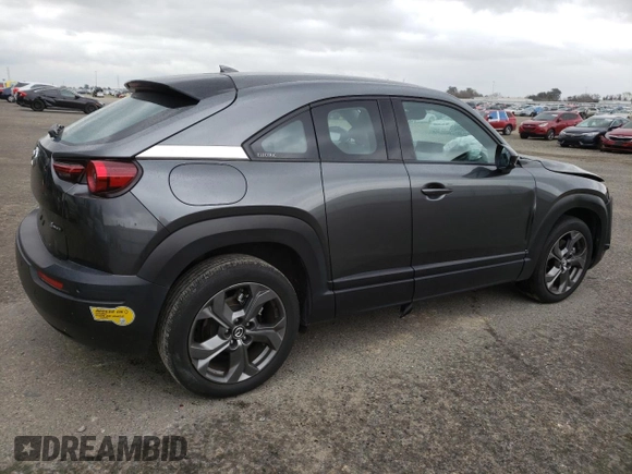 2022 Mazda MX-30 Premium Plus z VIN JM1DRADB4N0100893, wystawiony jako Copart lot #46955985 z przebiegiem 25 705 mil mil oraz Szkody całkowita. Historia ofert i sprzedaży dostępna na DreamBid. Obrazek 3.