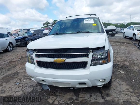 2014 Chevrolet Suburban LT with VIN 1GNSCJE07ER211222, listed as a IAAI auction lot 42428084 with 214,712 mi miles and . Bid and sale history available at DreamBid. Image 12.