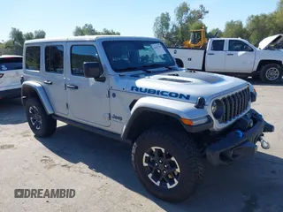 2024 Jeep Wrangler Rubicon X z VIN 1C4RJXR64RW140647, wystawiony jako IAAI lot #41835709 z przebiegiem 19 816 mil mil oraz . Historia ofert i sprzedaży dostępna na DreamBid. Obrazek 1.