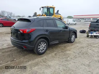 2014 Mazda CX-5 Touring with VIN JM3KE2CY7E0341658, listed as a IAAI auction lot 41915807 with 99,287 mi miles. Bid and sale history available at carsss.com. Image 4.