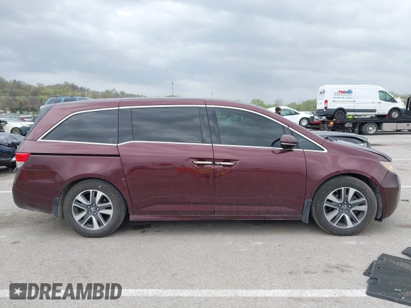 2014 Honda Odyssey Touring with VIN 5FNRL5H94EB127695, listed as a IAAI auction lot 41936109 with 221,786 mi miles and . Bid and sale history available at DreamBid. Image 13.