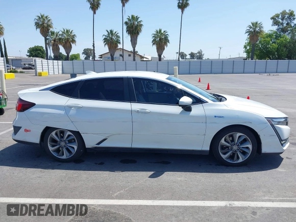 2018 Honda Clarity z VIN JHMZC5F10JC015706, wystawiony jako IAAI lot #42290573 z przebiegiem 158 987 mil mil oraz . Historia ofert i sprzedaży dostępna na DreamBid. Obrazek 13.