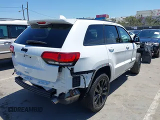 2018 Jeep Grand Cherokee Altitude with VIN 1C4RJEAG2JC404009, listed as a IAAI auction lot 42691304 with 60,948 mi miles and . Bid and sale history available at DreamBid. Image 4.