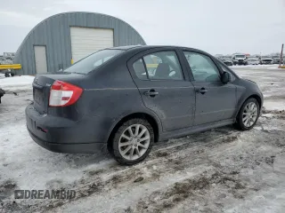 2011 Suzuki SX4 with VIN JS2YC5A44B6300171, listed as a Copart auction lot 87673685 with 116,483 mi miles and Salvage Title. Bid and sale history available at DreamBid. Image 3.