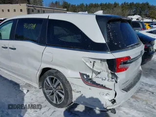 2023 Honda Odyssey Touring with VIN 5FNRL6H81PB008129, listed as a IAAI auction lot 41610714 with 57,273 mi miles and . Bid and sale history available at DreamBid. Image 6.