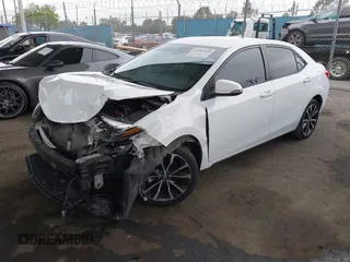 2019 Toyota Corolla L with VIN 5YFBURHE7KP862111, listed as a IAAI auction lot 42205368 with 96,823 mi miles and . Bid and sale history available at DreamBid. Image 2.
