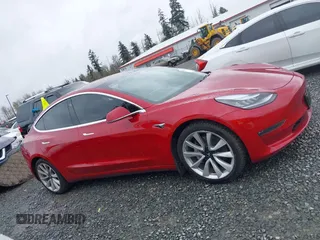 2018 Tesla Model 3 Long Range Battery z VIN 5YJ3E1EB2JF087823, wystawiony jako IAAI lot #41903609 z przebiegiem 69 749 mil mil oraz . Historia ofert i sprzedaży dostępna na DreamBid. Obrazek 14.