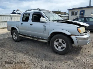 2000 Nissan Frontier XE with VIN 1N6ED27T8YC367452, listed as a Copart auction lot 55866345 with 242,945 mi miles and Salvage title. Bid and sale history available at DreamBid. Image 4.