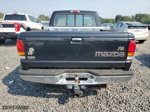 1997 Mazda B-Series 2WD Truck with VIN 4F4CR12A3VTM30133, listed as a Copart auction lot 70031404 with 294,427 mi miles and Salvage Title. Bid and sale history available at carsss.com. Image 6.