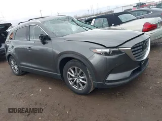 2019 Mazda CX-9 Touring z VIN JM3TCBCY0K0320379, wystawiony jako IAAI lot #41838065 z przebiegiem Nie podano mil oraz . Historia ofert i sprzedaży dostępna na DreamBid. Obrazek 1.
