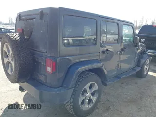 2016 Jeep Wrangler Unlimited 75th Anniversary with VIN 1C4BJWEG9GL250408, listed as a IAAI auction lot 41793706 with 102,436 mi miles. Bid and sale history available at carsss.com. Image 4.