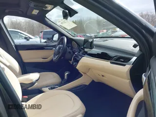 2017 BMW X1 xDrive28i with VIN WBXHT3Z39H4A57753, listed as a IAAI auction lot 41726790 with 52,509 mi miles. Bid and sale history available at carsss.com. Image 5.