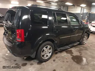 2011 Honda Pilot Touring with VIN 5FNYF4H97BB099528, listed as a IAAI auction lot 41721800 with 132,979 mi miles. Bid and sale history available at carsss.com. Image 4.