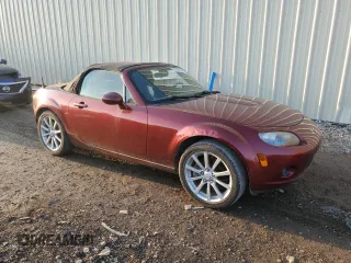 2007 Mazda MX-5 Miata Sport z VIN JM1NC25F970124896, wystawiony jako Copart lot #83624394 z przebiegiem 62 735 mil mil oraz Szkoda całkowita • Salvage title. Historia ofert i sprzedaży dostępna na DreamBid. Obrazek 4.