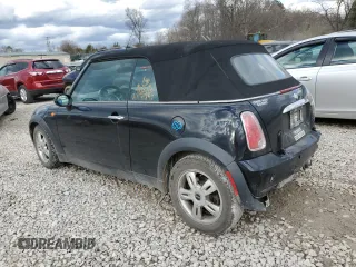 2005 MINI Convertible with VIN WMWRF33485TG11549, listed as a Copart auction lot 87285984 with 58,934 mi miles and Salvage title. Bid and sale history available at DreamBid. Image 2.
