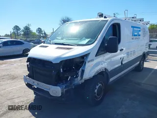2020 Ford Transit Cargo z VIN 1FTBR1Y84LKB79621, wystawiony jako IAAI lot #41802213 z przebiegiem 89 167 mil mil oraz . Historia ofert i sprzedaży dostępna na DreamBid. Obrazek 2.