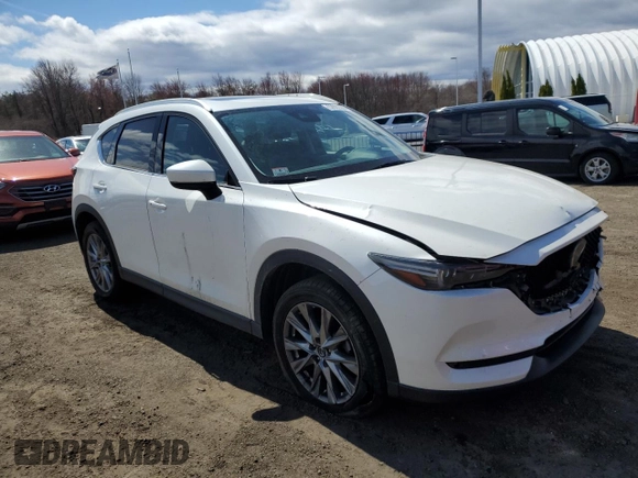 2020 Mazda CX-5 Grand Touring with VIN JM3KFBDM9L1803881, listed as a Copart auction lot 52822395 with 49,604 mi miles and Salvage Title. Bid and sale history available at carsss.com. Image 4.
