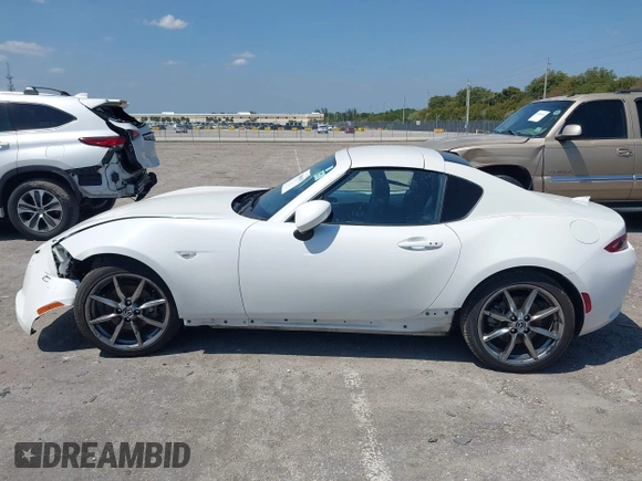 2021 Mazda MX-5 Miata Grand Touring z VIN JM1NDAM75M0450871, wystawiony jako IAAI lot #42060495 z przebiegiem 48 670 mil mil oraz . Historia ofert i sprzedaży dostępna na DreamBid. Obrazek 14.