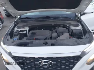 2019 Hyundai Santa Fe SE z VIN 5NMS23AD9KH077362, wystawiony jako IAAI lot #41890584 z przebiegiem 132 476 mil mil oraz . Historia ofert i sprzedaży dostępna na DreamBid. Obrazek 10.