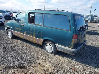 1993 Ford Aerostar Eddie Bauer with VIN 1FMDA41X6PZA63185, listed as a IAAI auction lot 41708318 with Not Provided miles. Bid and sale history available at carsss.com. Image 3.