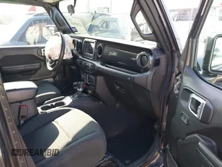 2022 Jeep Wrangler Unlimited Sport S with VIN 1C4HJXDG5NW105931, listed as a IAAI auction lot 42349628 with 37,314 mi miles and . Bid and sale history available at DreamBid. Image 5.